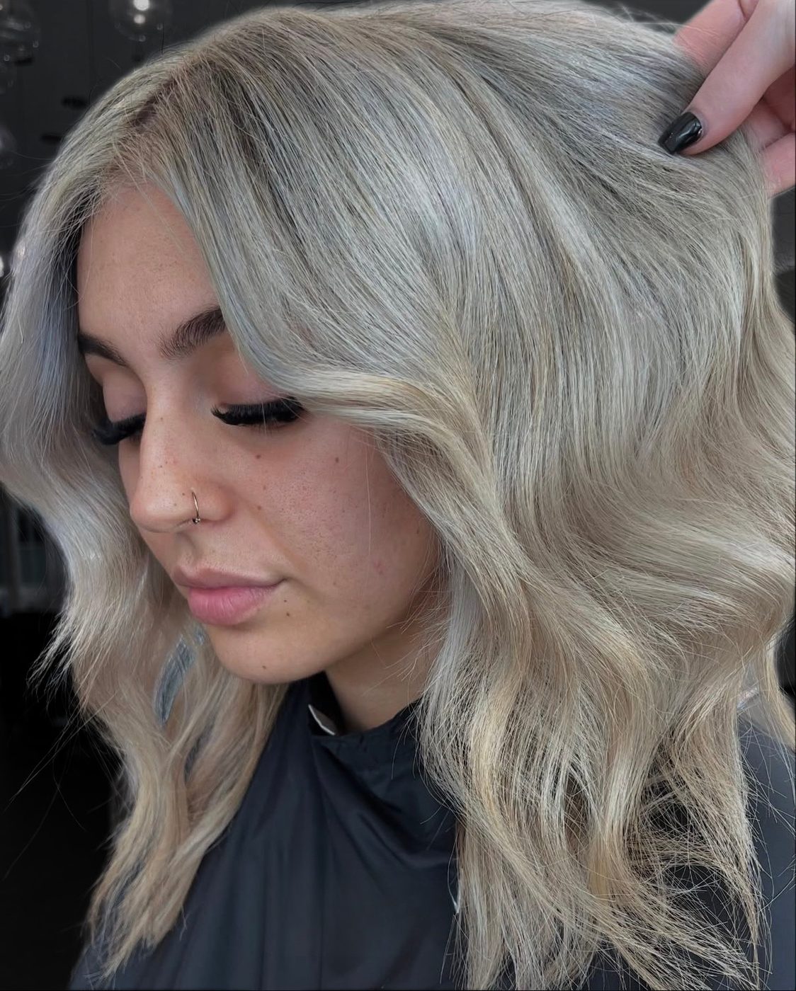 Soft ash blonde with glossy, toned waves