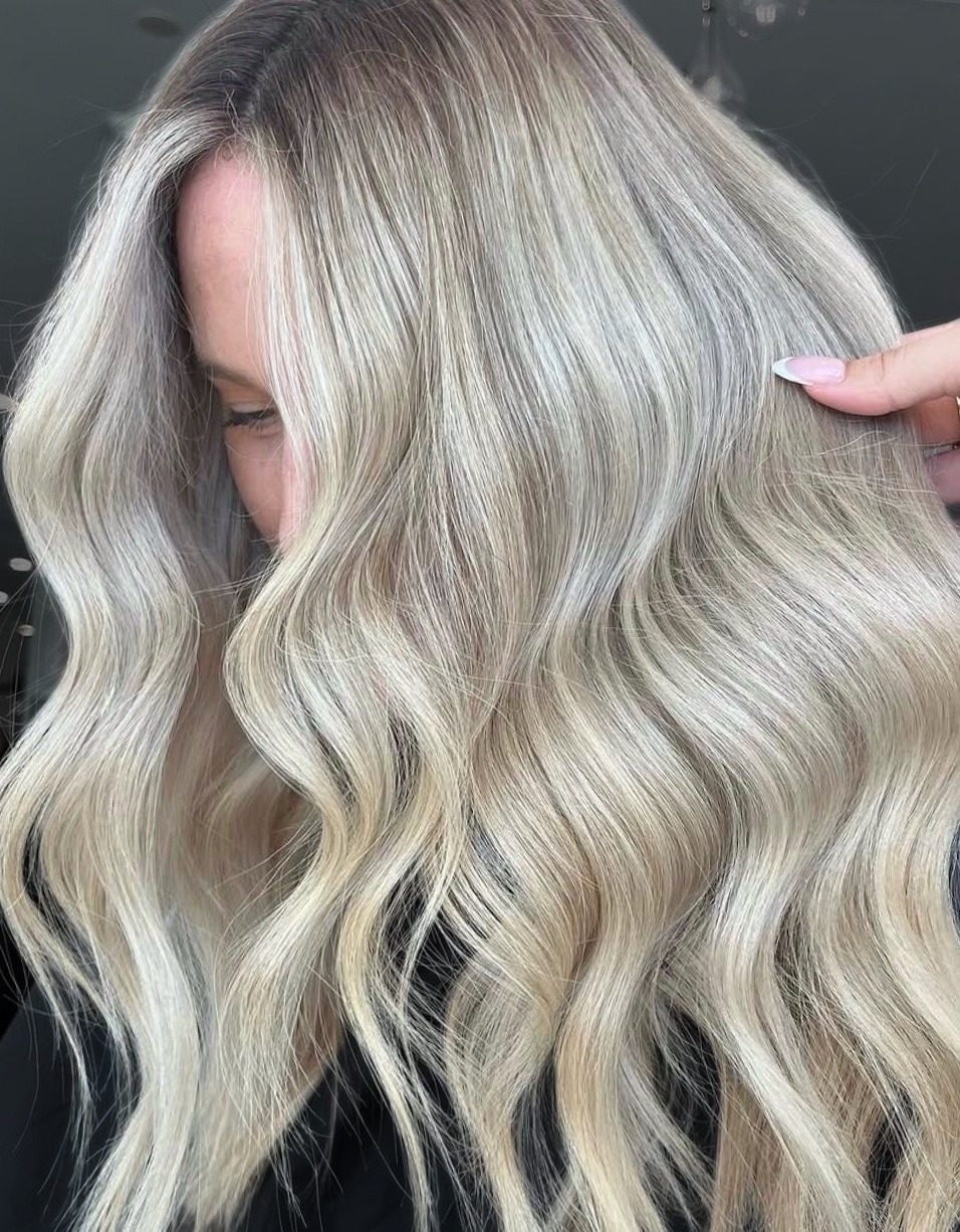 Cool silver blonde balayage with seamless grow-out